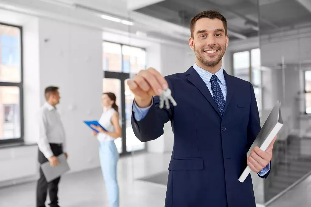 Smiling realtor with keys